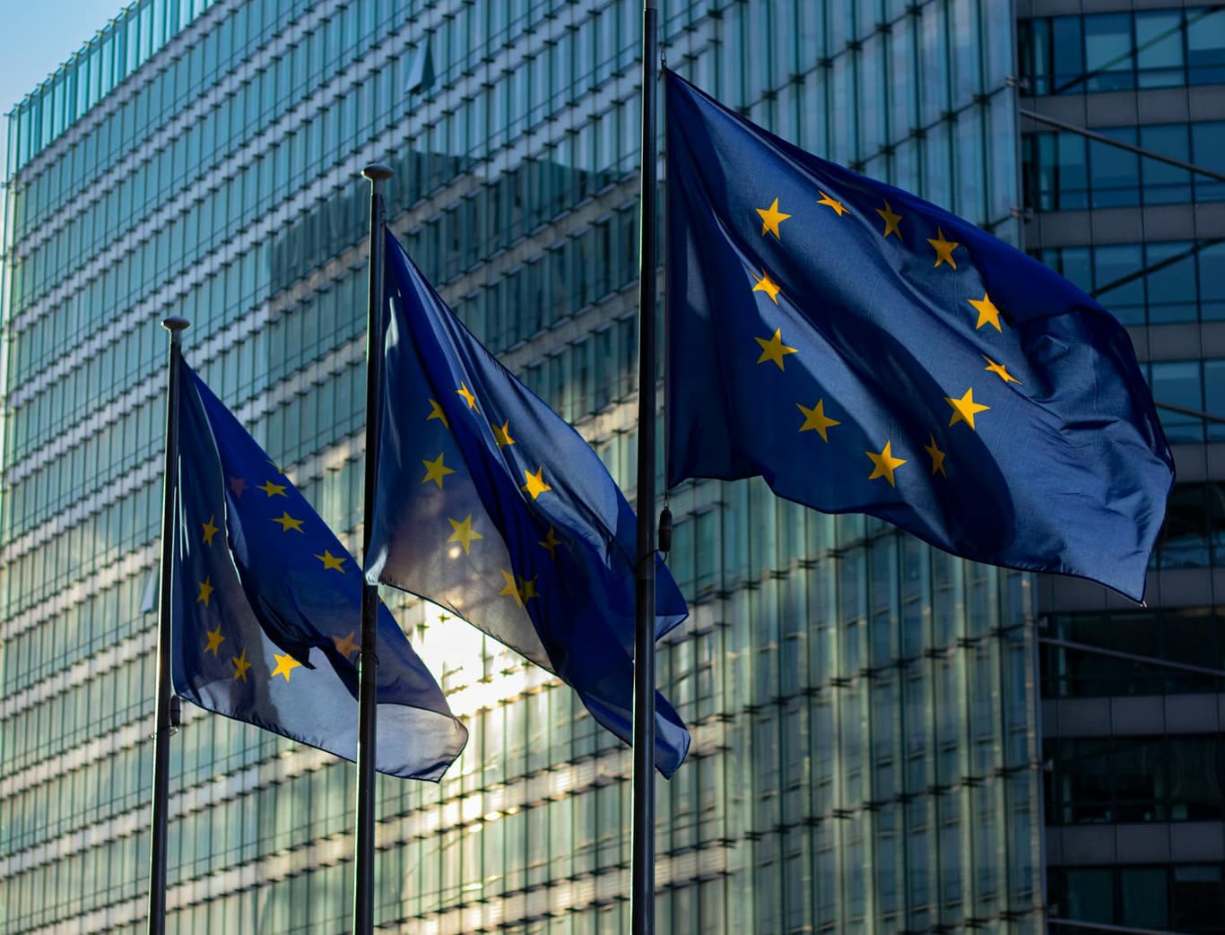 European Union and EEA flags outside institutional building representing passporting rights