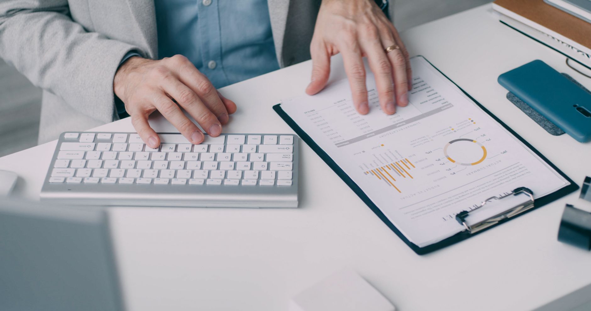 Financial documents and laptop on desk – tax planning and compliance