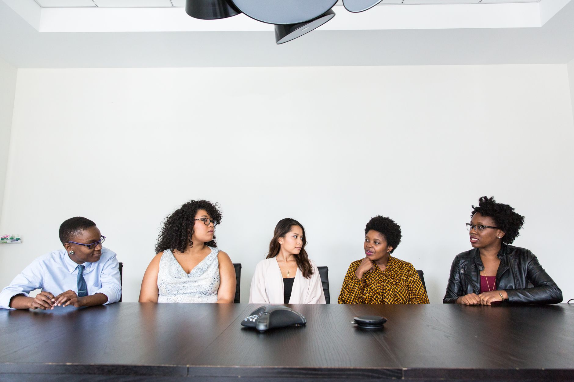 Business team discussing payment infrastructure strategy at a meeting table