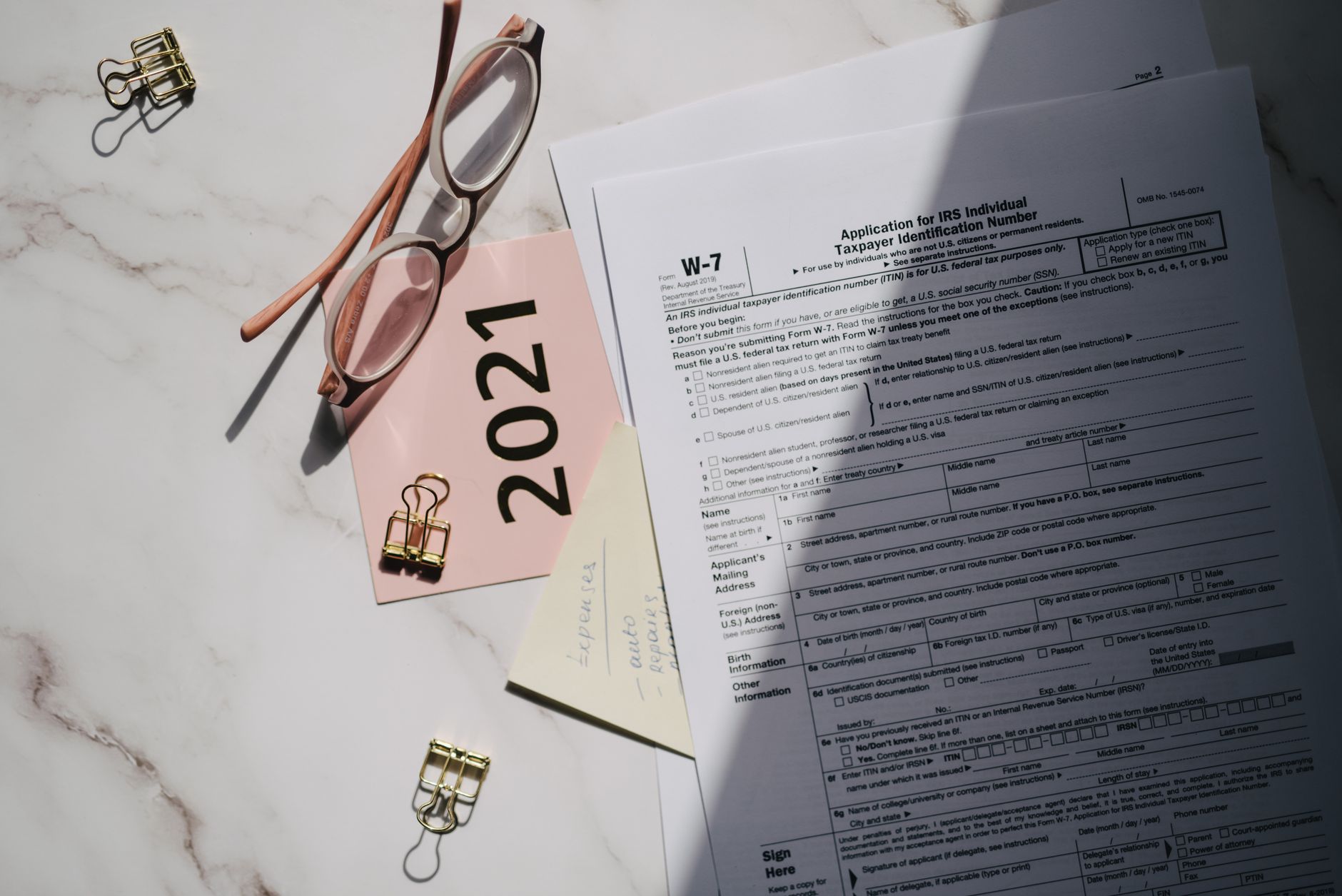 Business documents and compliance paperwork on a desk