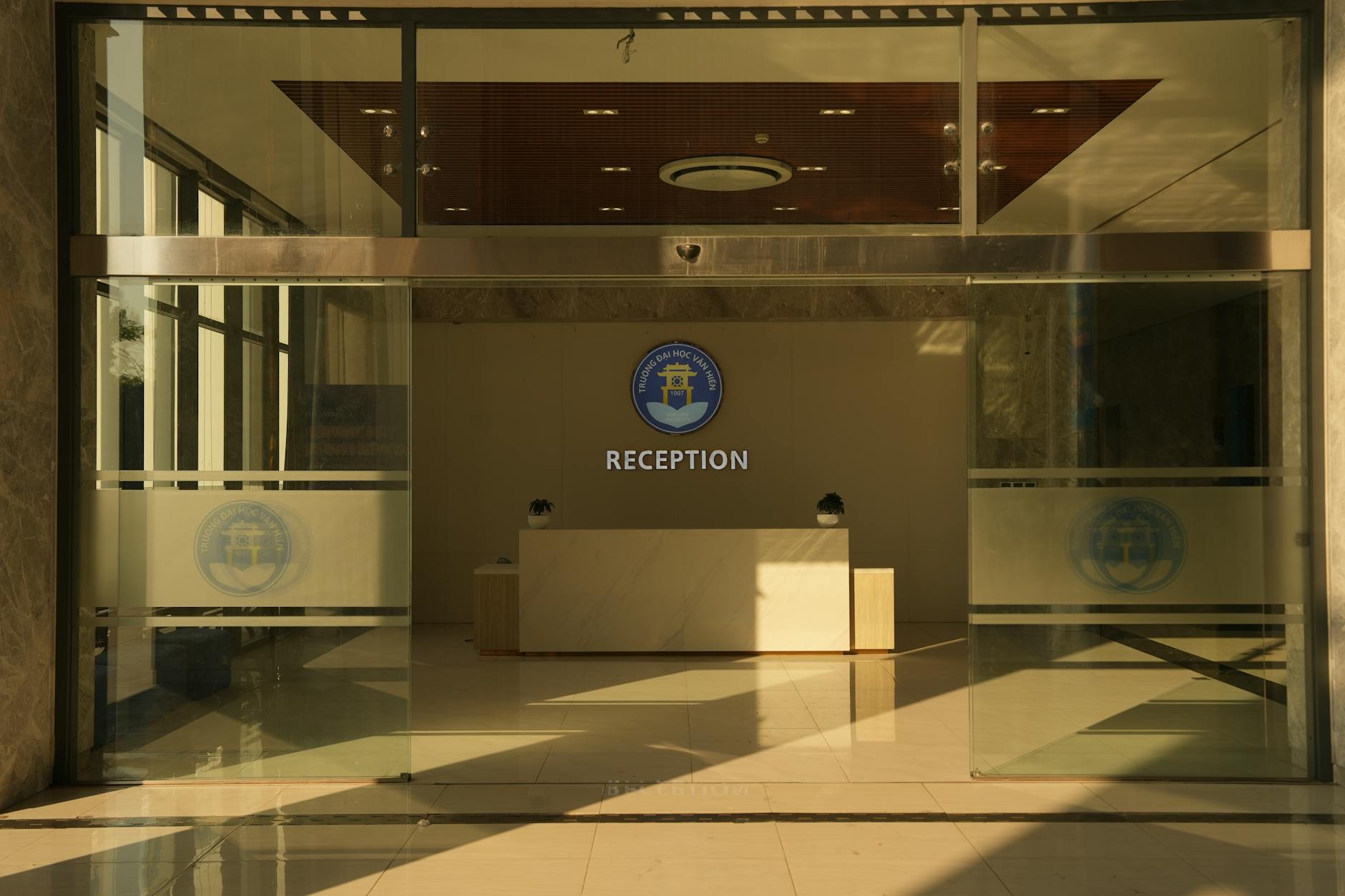 Multi-stage application process illustrated by corporate office reception area