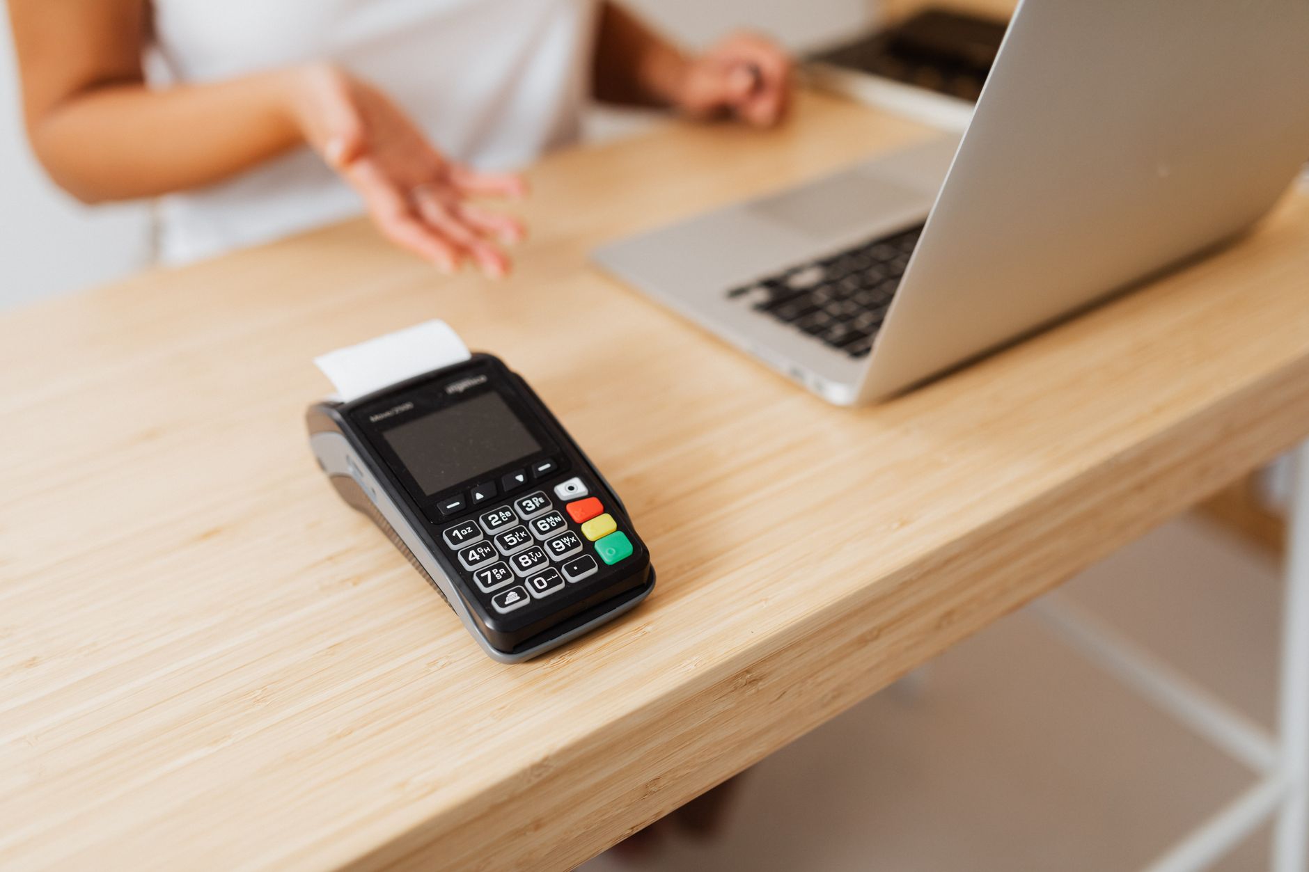 Business professional working on laptop with payment infrastructure