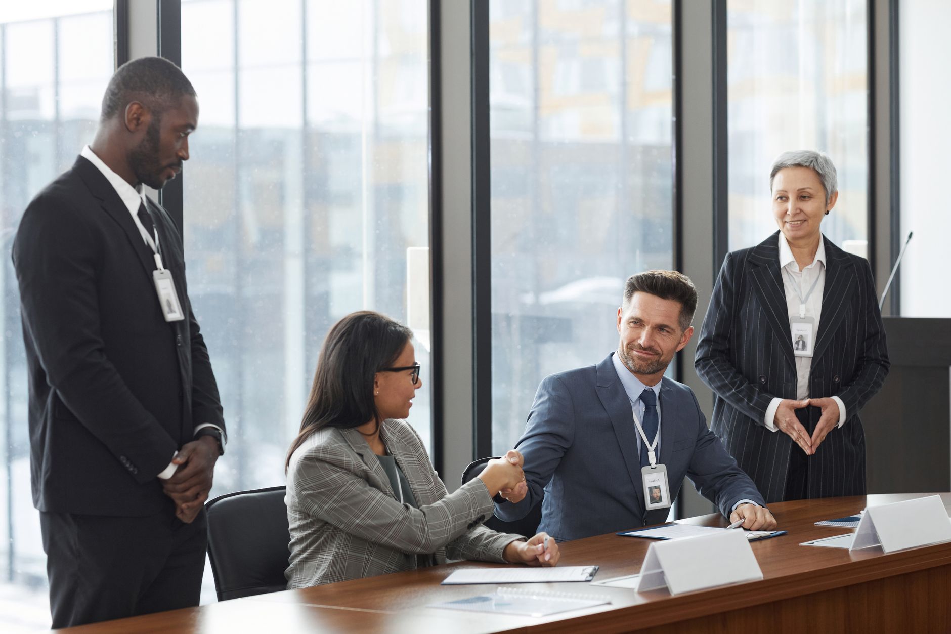 Business meeting in modern corporate office discussing cross-border financial structure